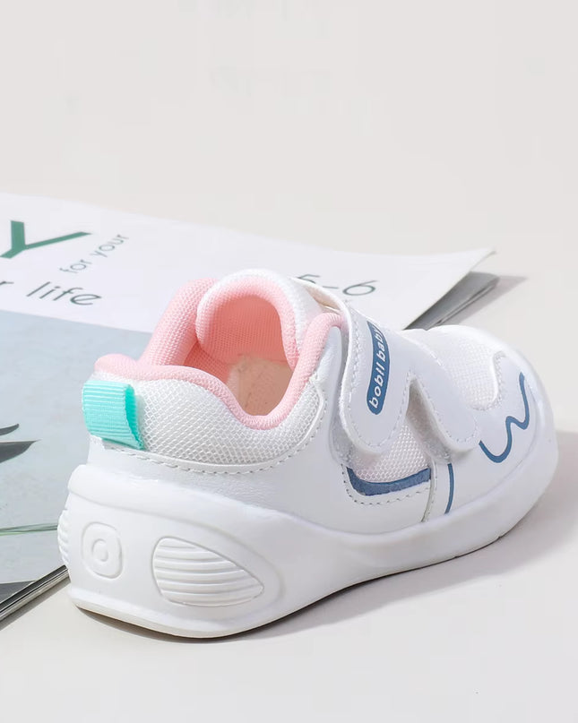 White toddler sneakers with pink lining and Velcro straps – lightweight baby shoes