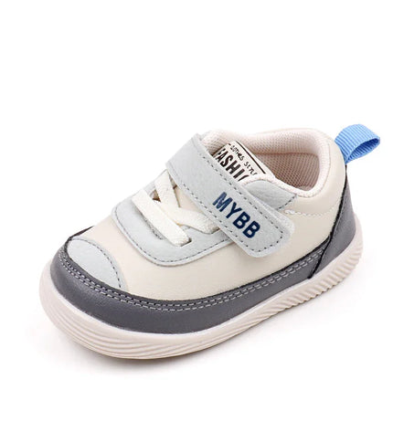 White and Gray Imported baby sneakers with a soft sole, breathable mesh upper, and secure hook-and-loop strap for comfort and stability