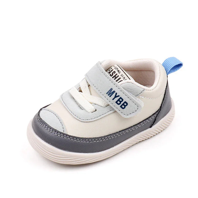 White and Gray Imported baby sneakers with a soft sole, breathable mesh upper, and secure hook-and-loop strap for comfort and stability