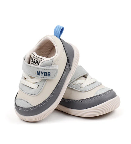 White and Gray Imported baby sneakers with a soft sole, breathable mesh upper, and secure hook-and-loop strap for comfort and stability