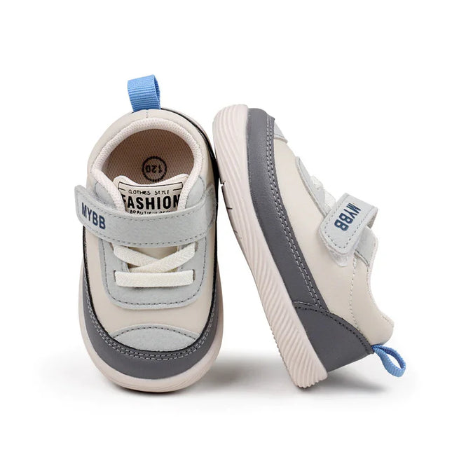 White and Gray Imported baby sneakers with a soft sole, breathable mesh upper, and secure hook-and-loop strap for comfort and stability
