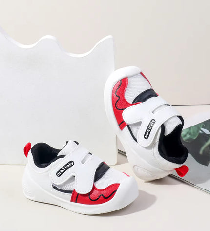 White toddler sneakers with black lining, red accent and Velcro straps – lightweight baby shoes