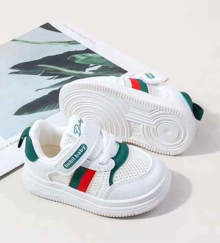 White and green toddler sneakers with soft sole and non-slip grip – first walker shoes for boys