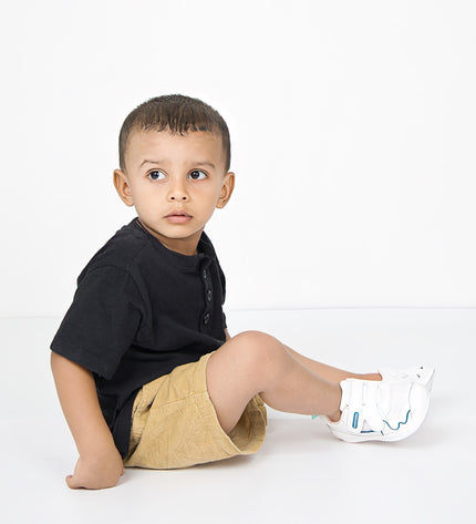 White toddler sneakers with pink lining, blue accent and Velcro straps – lightweight baby shoes