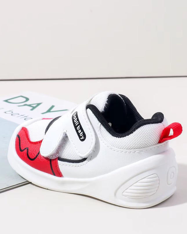 White toddler sneakers with black lining, red accent and Velcro straps – lightweight baby shoes