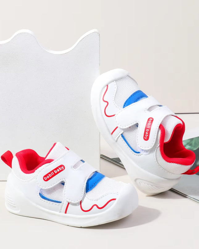 White toddler sneakers with red lining, blue accent and Velcro straps – lightweight baby shoes