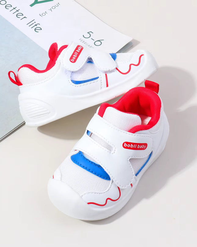 White toddler sneakers with red lining, blue accent and Velcro straps – lightweight baby shoes