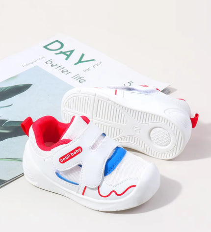 White toddler sneakers with red lining, blue accent and Velcro straps – lightweight baby shoes