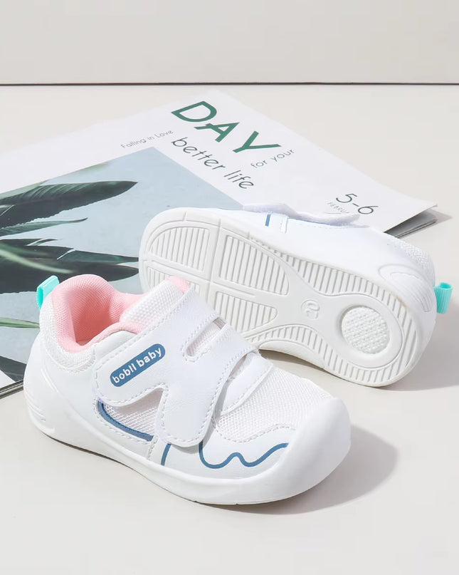 White toddler sneakers with pink lining and Velcro straps – lightweight baby shoes