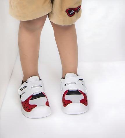 White toddler sneakers with black lining, red accent and Velcro straps – lightweight baby shoes