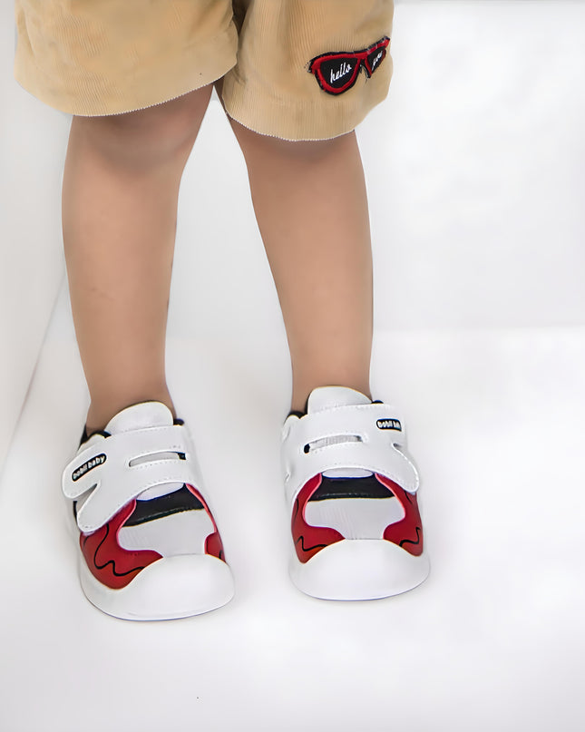 White toddler sneakers with black lining, red accent and Velcro straps – lightweight baby shoes