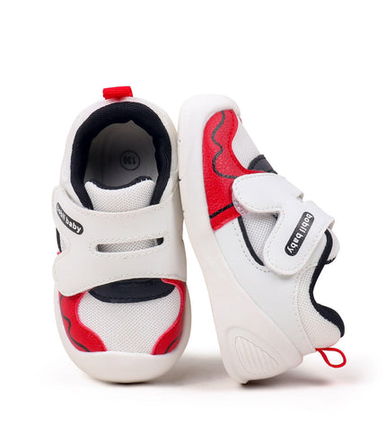 White toddler sneakers with black lining, red accent and Velcro straps – lightweight baby shoes