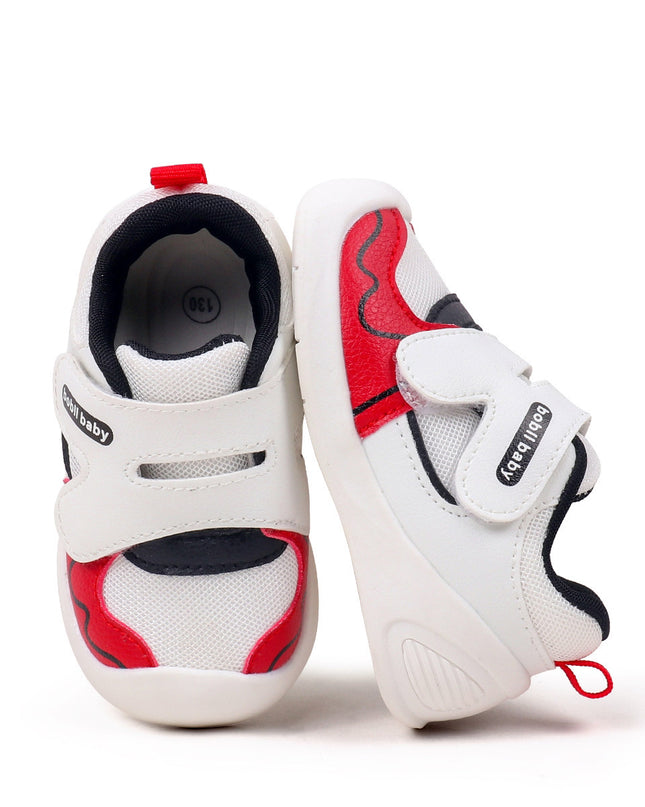 White toddler sneakers with black lining, red accent and Velcro straps – lightweight baby shoes
