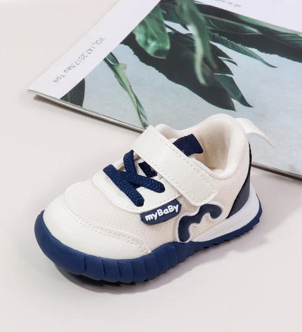 White and navy blue combination color imported baby sneakers with a soft sole, breathable mesh upper, and secure hook-and-loop strap for comfort and stability